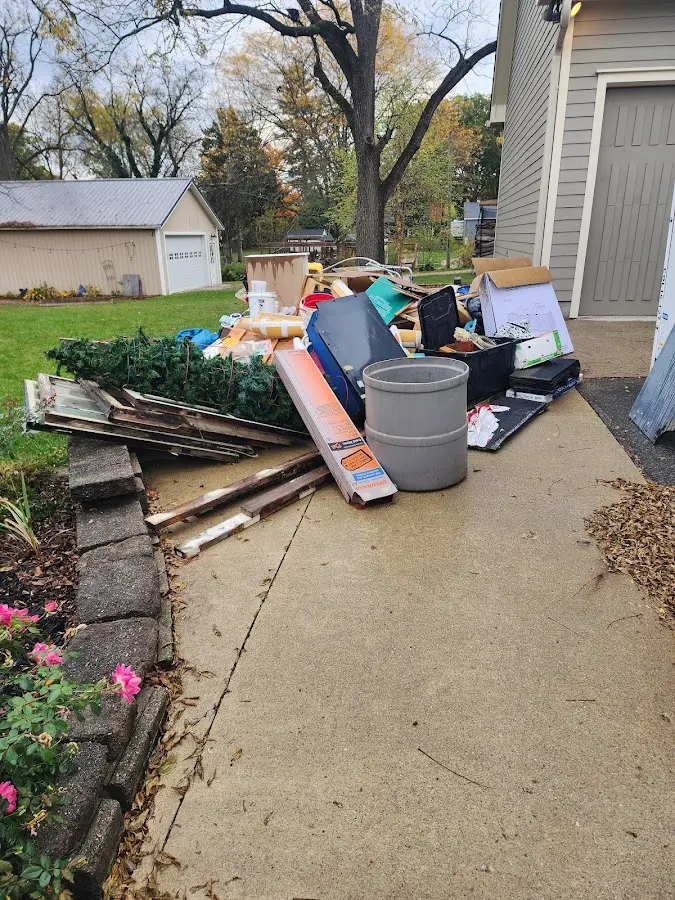 Dumpster being loaded with debris for 30 Yard Dumpster Rental in Wellford